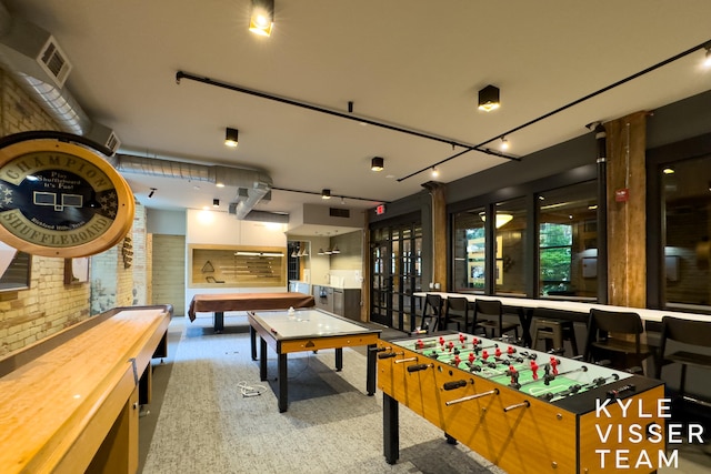 rec room featuring brick wall and billiards