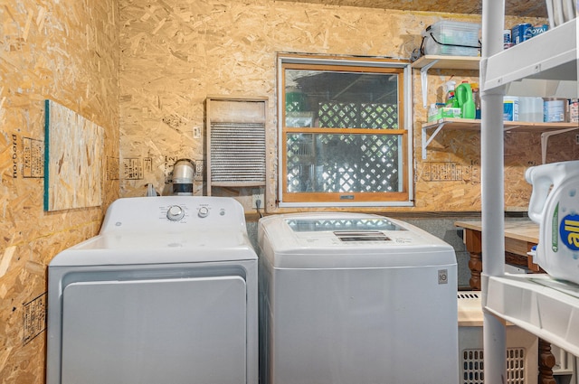 laundry room with independent washer and dryer