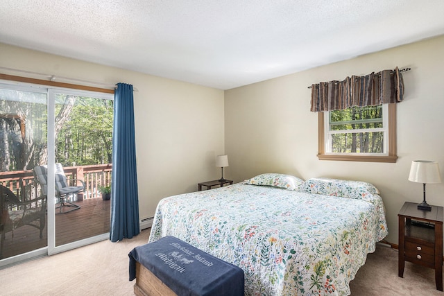 bedroom with access to exterior, carpet floors, multiple windows, and a baseboard heating unit