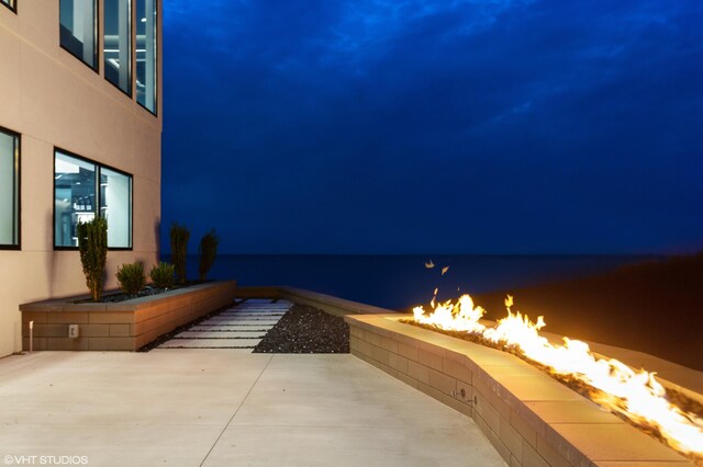 639 Sul Lago Ave S, Benton Harbor, MI 49022 - patio at twilight with an outdoor fire pit and a patio