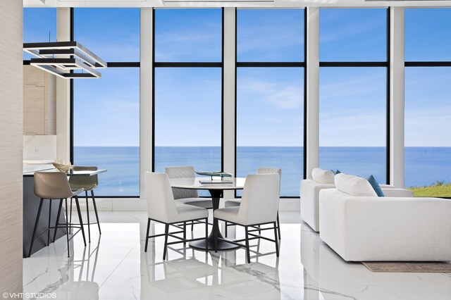 639 Sul Lago Ave S, Benton Harbor, MI 49022 - dining area featuring a water view and expansive windows