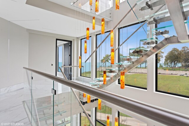 639 Sul Lago Ave S, Benton Harbor, MI 49022 - hallway featuring stairway, marble tiled floors, and a high ceiling