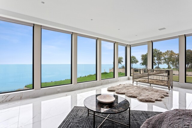 639 Sul Lago Ave S, Benton Harbor, MI 49022 - living area with healthy amount of natural light, a water view, and marble tiled flooring