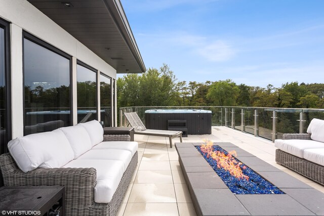 639 Sul Lago Ave S, Benton Harbor, MI 49022 - view of patio / terrace featuring a hot tub and an outdoor living space with a fire pit