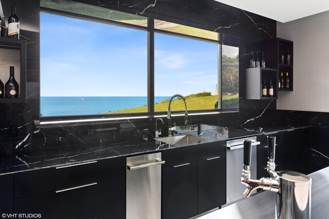 639 Sul Lago Ave S, Benton Harbor, MI 49022 - kitchen featuring dark cabinetry, a sink, modern cabinets, a water view, and dark countertops