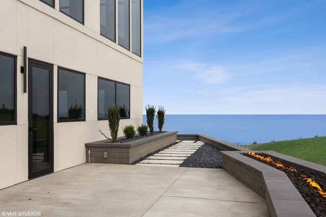 639 Sul Lago Ave S, Benton Harbor, MI 49022 - view of patio / terrace featuring a water view and a fire pit