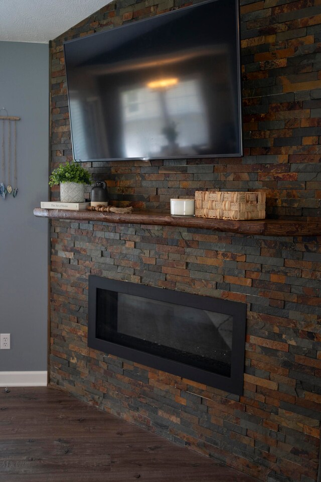 interior details with hardwood / wood-style floors and a textured ceiling