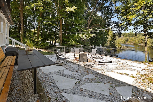 view of patio with a water view