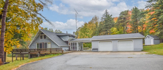 view of front facade featuring an outbuilding and a deck