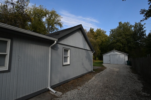 view of side of home featuring an outdoor structure