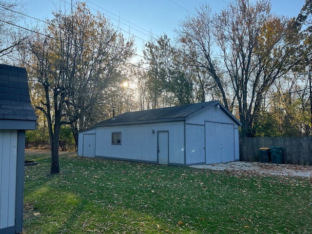 view of outbuilding featuring a yard