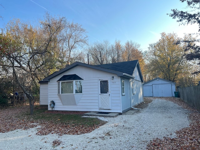 view of front of property with an outbuilding and a garage