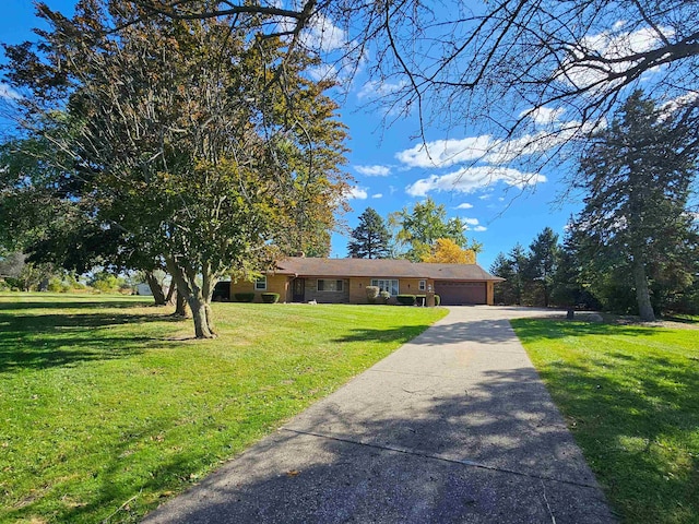 ranch-style home featuring a front yard and a garage