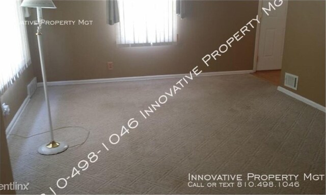 3019 Chicago Blvd, Flint, MI 48503 - carpeted spare room featuring baseboards