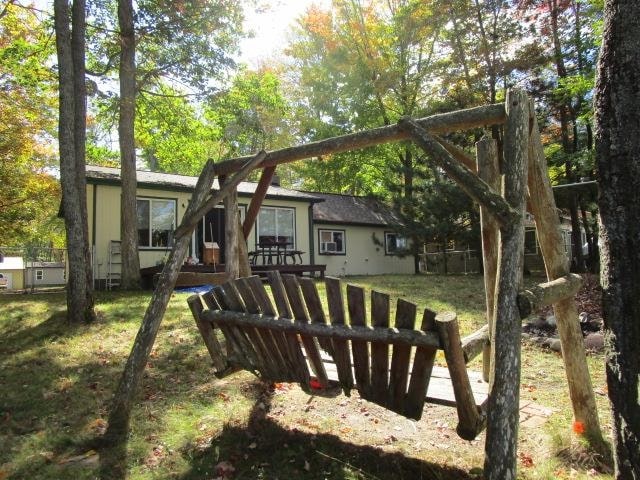 view of playground with a lawn