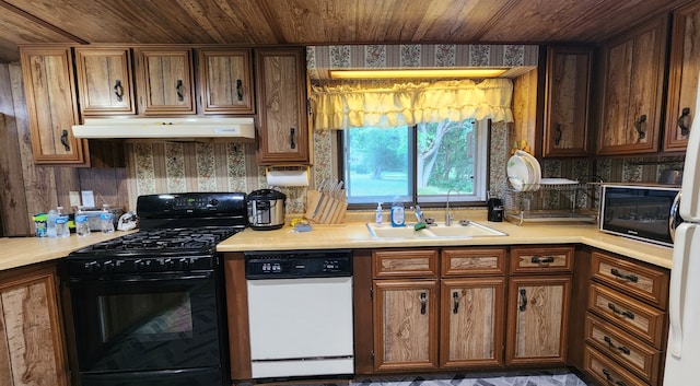 kitchen with black appliances, wooden ceiling, and sink