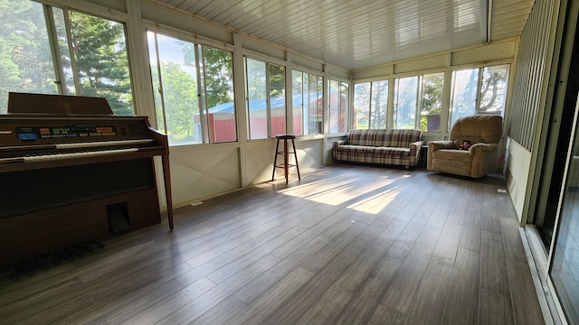 sunroom / solarium featuring wooden ceiling