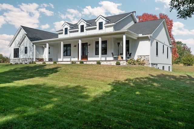 view of front facade with a front yard and a porch