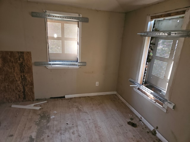 spare room with light wood-type flooring