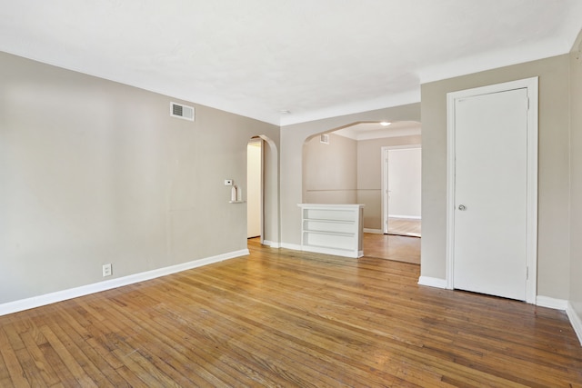 empty room featuring wood-type flooring