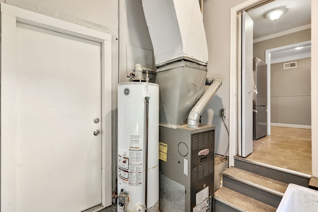 utility room featuring gas water heater