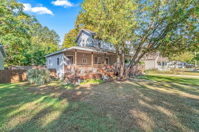 view of front of property featuring a wooden deck and a front yard