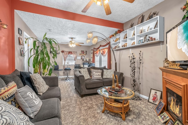 living room featuring carpet, a textured ceiling, and ceiling fan