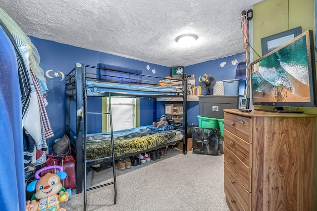 bedroom featuring carpet flooring and a textured ceiling