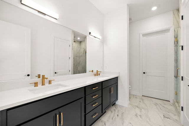 bathroom with vanity, toilet, and an enclosed shower