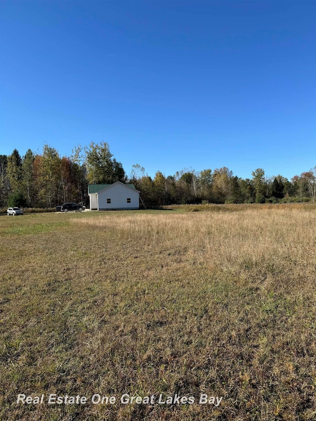 view of yard with a rural view