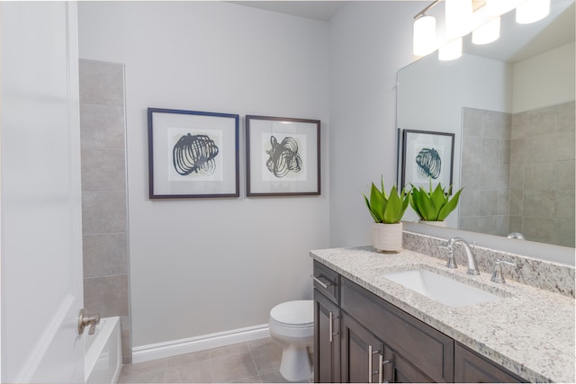 full bathroom with tile patterned floors, vanity, tiled shower / bath combo, and toilet