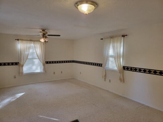 4085 N Cedar Lake Rd, Edmore, MI 48829 - carpeted spare room with plenty of natural light and ceiling fan