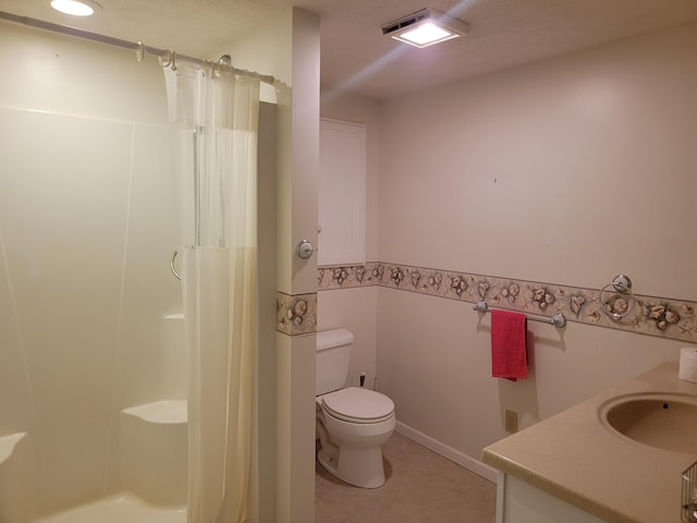 bathroom featuring curtained shower, toilet, and vanity