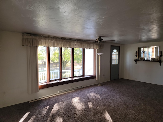 unfurnished living room featuring carpet floors and ceiling fan