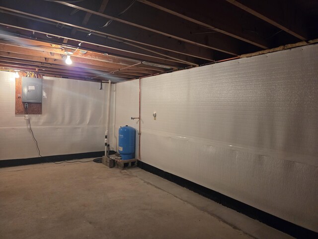 4085 N Cedar Lake Rd, Edmore, MI 48829 - unfinished basement featuring a water pressure tank and electric panel