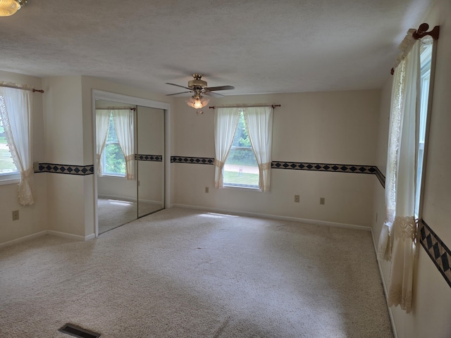 4085 N Cedar Lake Rd, Edmore, MI 48829 - carpeted spare room featuring a ceiling fan and baseboards