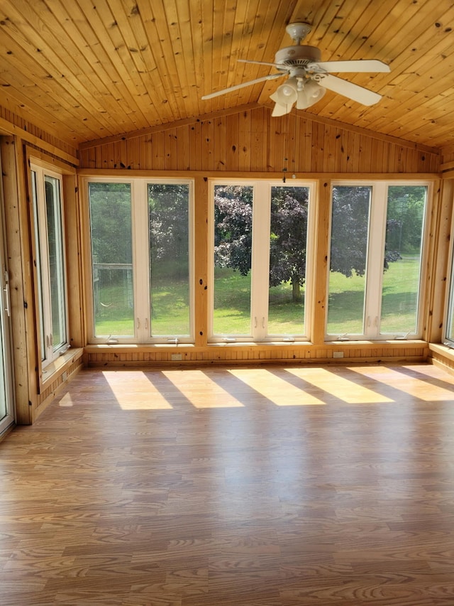 4085 N Cedar Lake Rd, Edmore, MI 48829 - unfurnished sunroom with vaulted ceiling, wood walls, plenty of natural light, wood finished floors, and wooden ceiling