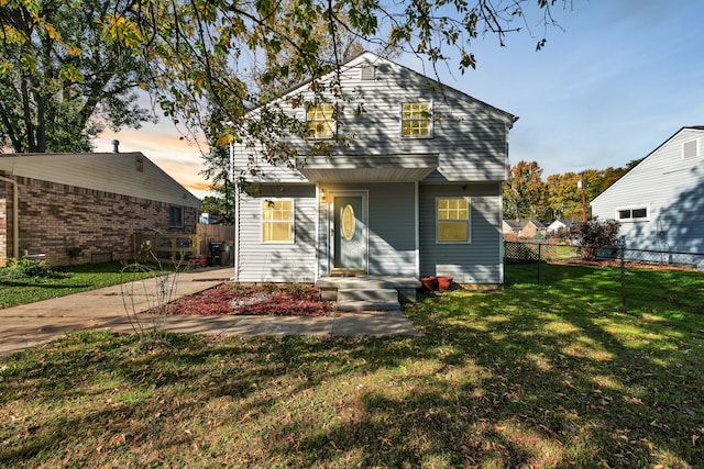 view of front of property with a yard