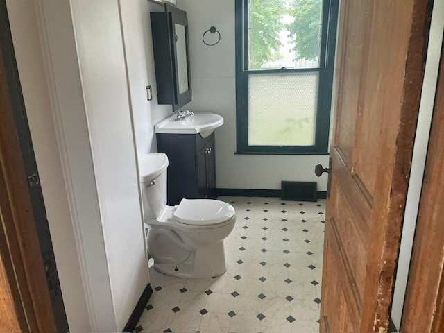 bathroom with vanity and toilet