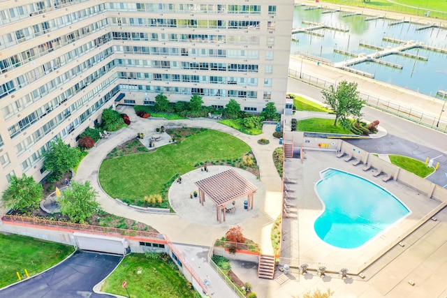 birds eye view of property with a water view