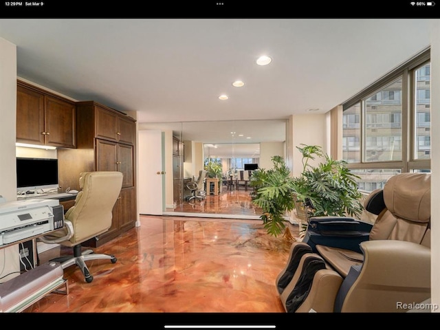 office with expansive windows and built in desk