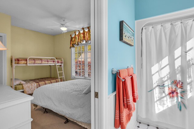 carpeted bedroom with a ceiling fan