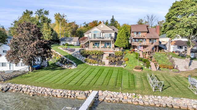 birds eye view of property with a water view