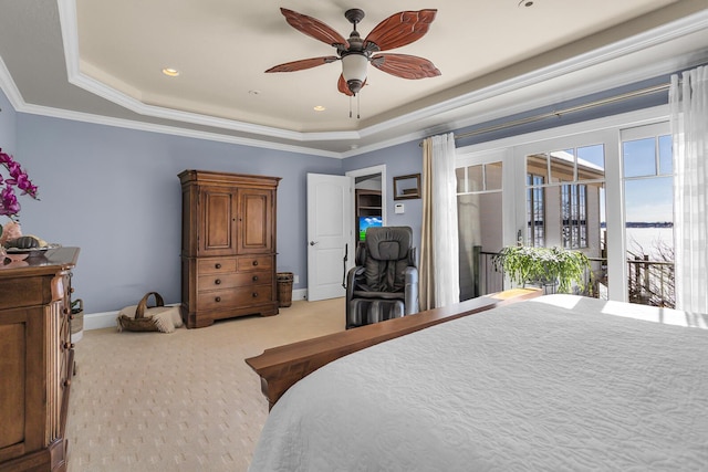 bedroom featuring light carpet, a tray ceiling, baseboards, and crown molding