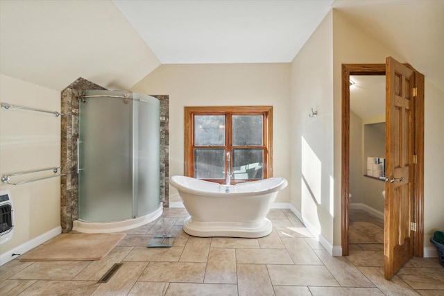 bathroom with lofted ceiling and plus walk in shower