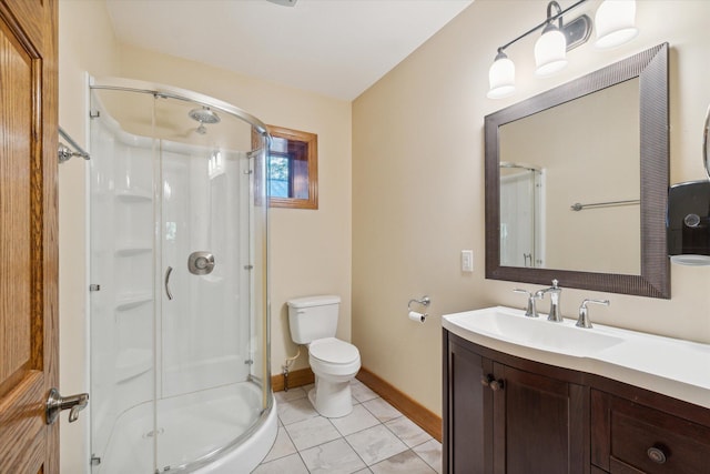 bathroom with vanity, toilet, and walk in shower