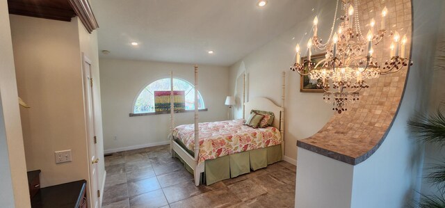 5578 Lake Shore Dr, Weidman, MI 48893 - bedroom featuring a chandelier, baseboards, and recessed lighting