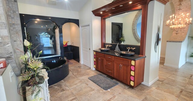 5578 Lake Shore Dr, Weidman, MI 48893 - full bath featuring vanity, a tub to relax in, and a chandelier