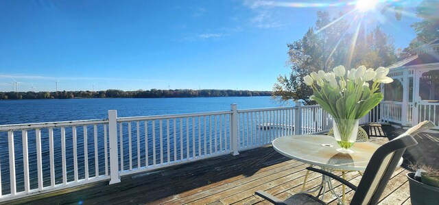 5578 Lake Shore Dr, Weidman, MI 48893 - wooden deck with a water view
