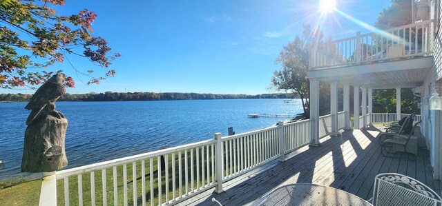 5578 Lake Shore Dr, Weidman, MI 48893 - wooden deck with a water view